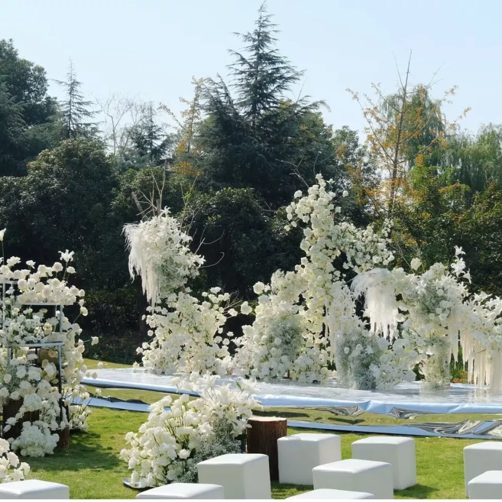 legant wedding ceremony decorated with white artificial roses and silk peonies arch