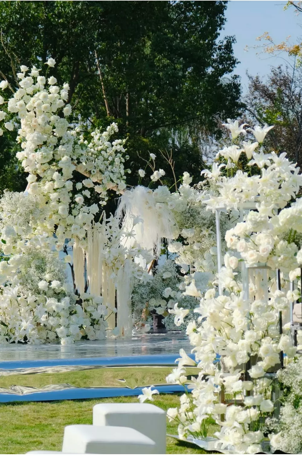 White artificial flower wall backdrop for romantic wedding photo shoot