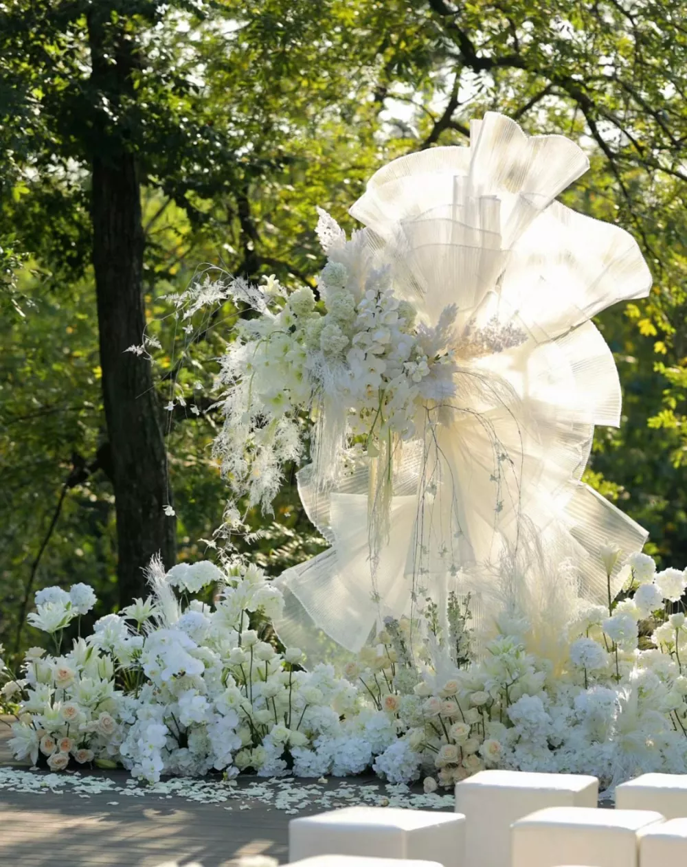 Round wedding arch with white artificial lilies and silk hydrangeas